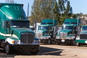 Specialised waste fleet trucks parked for commercial vehicle relocation services in Australia
